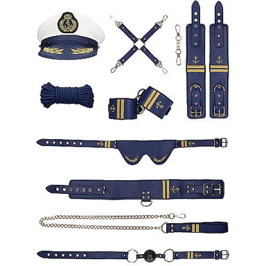 a blue and gold sailor themed bondage kit that includes a sailor hat, a hogtie, cuffs with chain, rope, a blindfold, a collar, a chain leash and a ball gag.