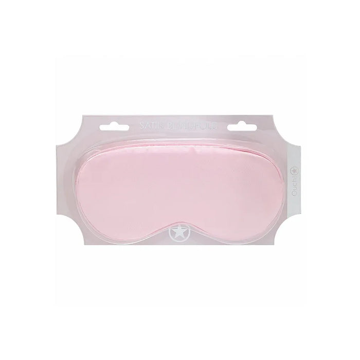 Pink sleep mask in packaging on a white background
