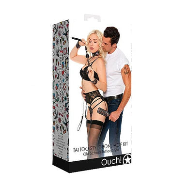a white display box depicting a black lingerie clad woman and a man wearing jeans and a white shirt. They are wearing and using the bondage kit items that are highlighted in the next picture