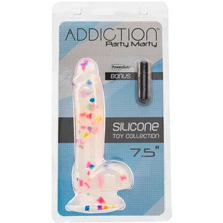 a confetti filled clear penis shaped dildo with balls and a suction cup. It is shown in its plastic packaging that also has a small black vibrator