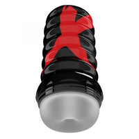 Clear masturbator with a black hard shell that has a large red x on it 