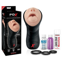 Black and grey packaging with the beige male masturbator with a nose and mouth opening and a black hard shell on the front. beside the packaging is the masturbator, three cockrings, lube, toy cleaner, and revive powder beside it 