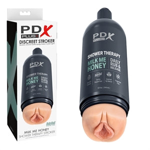 White packaging with the beige masturbator with a vaginal opening and a hard black shell in the shape of a shampoo bottle on the cover 