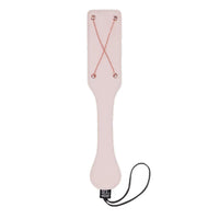 Pink paddle with rose gold accents on a white background