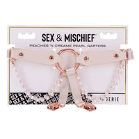 Sex & Mischief garter set with pearl accents on a white background