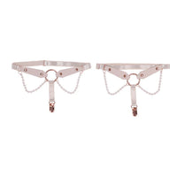 Rose gold & pearl garter set on a white background