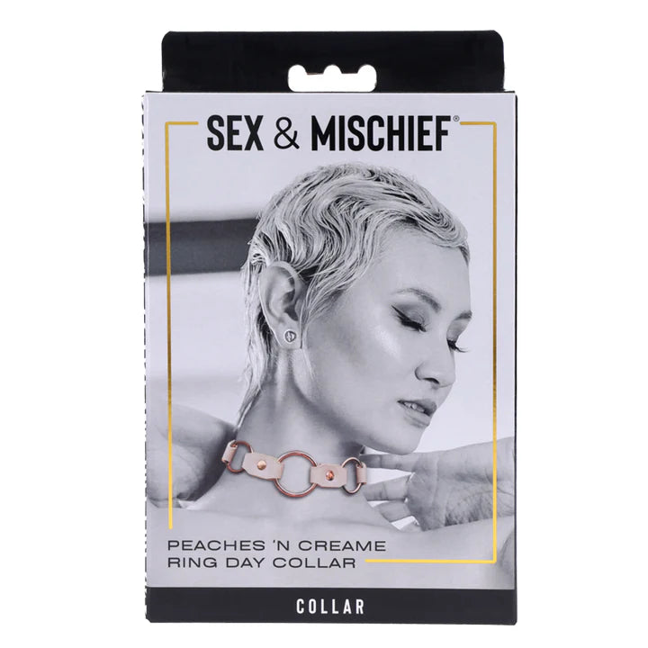 Product packaging for 'Peaches 'n Creame Ring Day Collar' by Sex & Mischief with a black and white image of a woman wearing a collar.