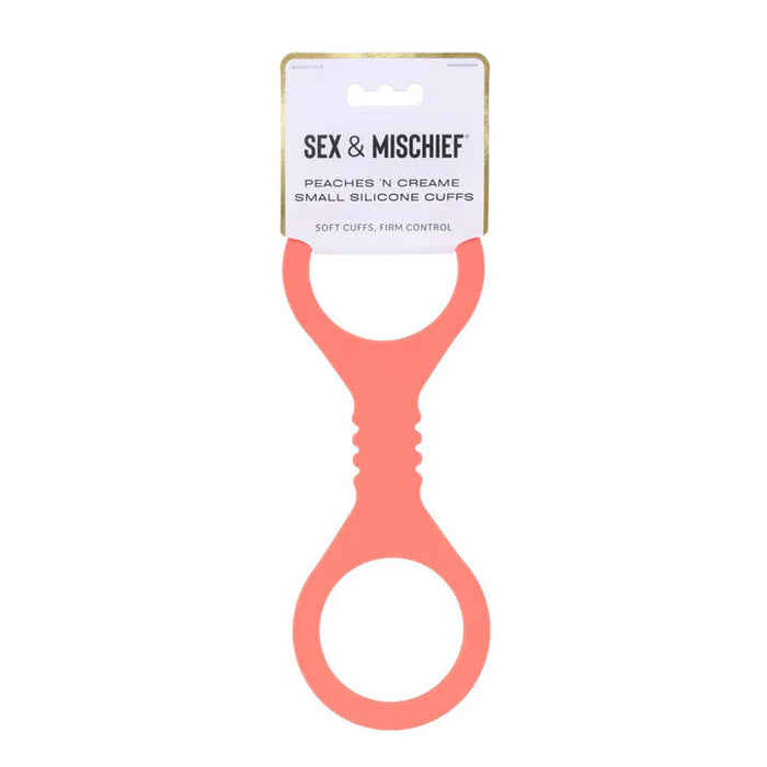 Coral silicone cuff with 'Sex & Mischief' label on a white background