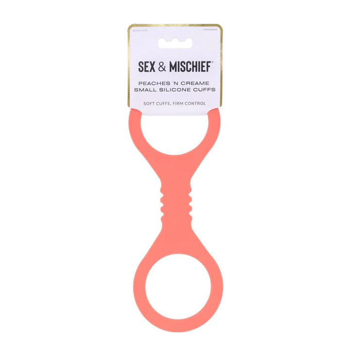 Coral silicone cuff with 'Sex & Mischief' label on a white background