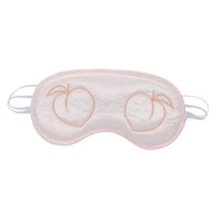 pink blindfold with 2 peaches over eye area