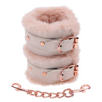 pink faux fur handcuffs with rose gold chain