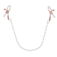 white pearl chain with rose gold and white nipple clamps