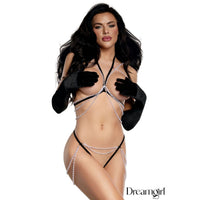woman wearing a black and white pearl bikini with black gloves
