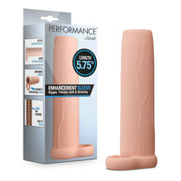 Performance 5.75 Enhancement Sleeve by Blush in skin-tone silicone with open-ended textured design for added girth and length, shown alongside retail packaging.