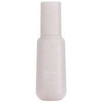 Skincare bottle labeled 'Skinny Dip' on a white background