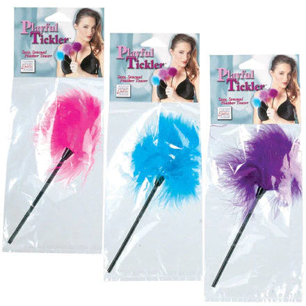 one pink, one blue and one purple feather sticks, each within its own plastic packaging