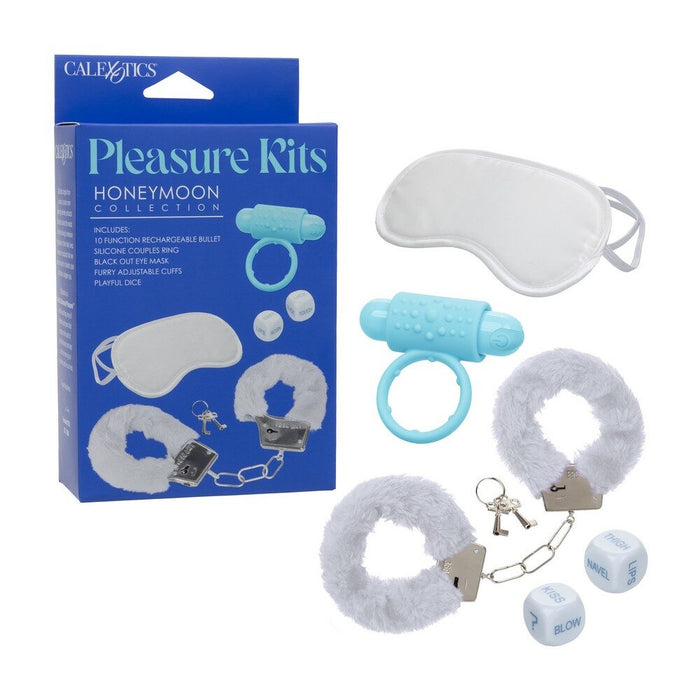 Pleasure kit with blue and white items including a bullet, eye mask, handcuffs, and dice, next to its packaging.