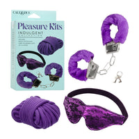 Purple pleasure kit with eye mask, handcuffs, and rope on a white background