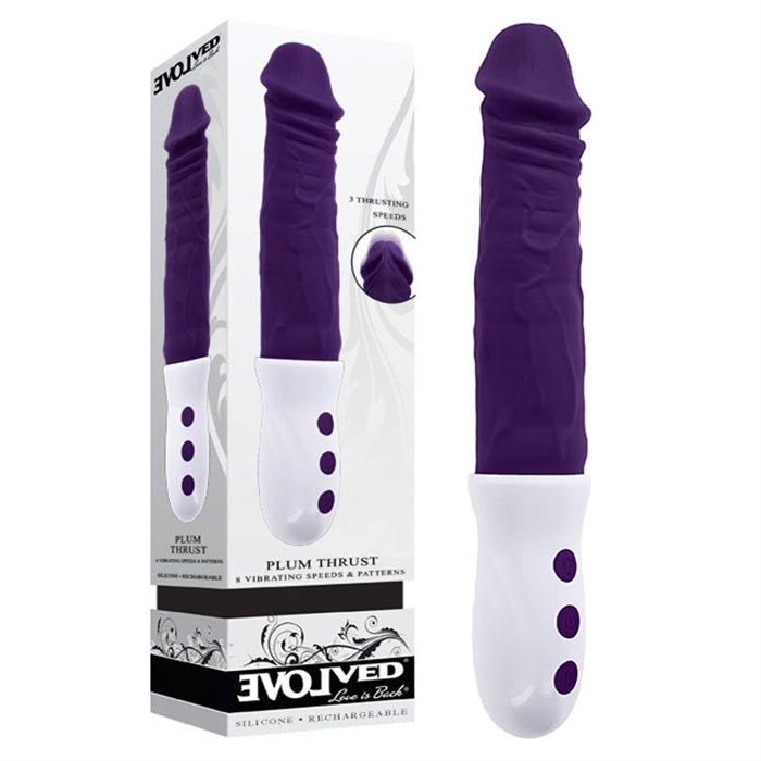 purple penis shaped thrusting vibrator with white handle beside display box