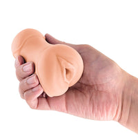 Hand holding a vaagina masturbator against a white background