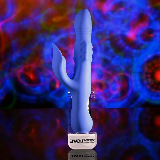 Blue vibrator with clitoral stimulator with 'EVOLVED' branding against a colorful abstract background