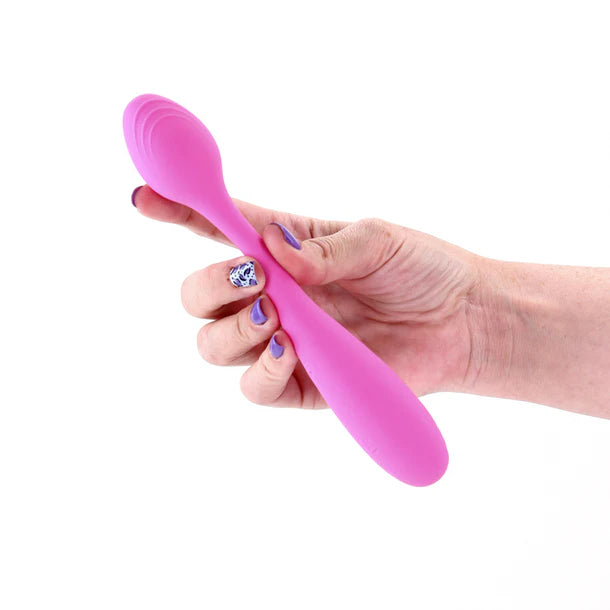 Hand holding a pink rose vibrator against a white background