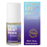 clear bottle of penis stimulating gel with purple ombre wrapper beside box packaging