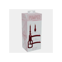 Pumped Vulva Pump silicone suction device in its original retail packaging, featuring a white box with pink accents and a graphic of the dark red and clear silicone pump.