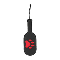 black vegan leather round paddle with puppy paw print in red