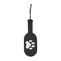 black vegan leather round paddle with puppy paw print in white