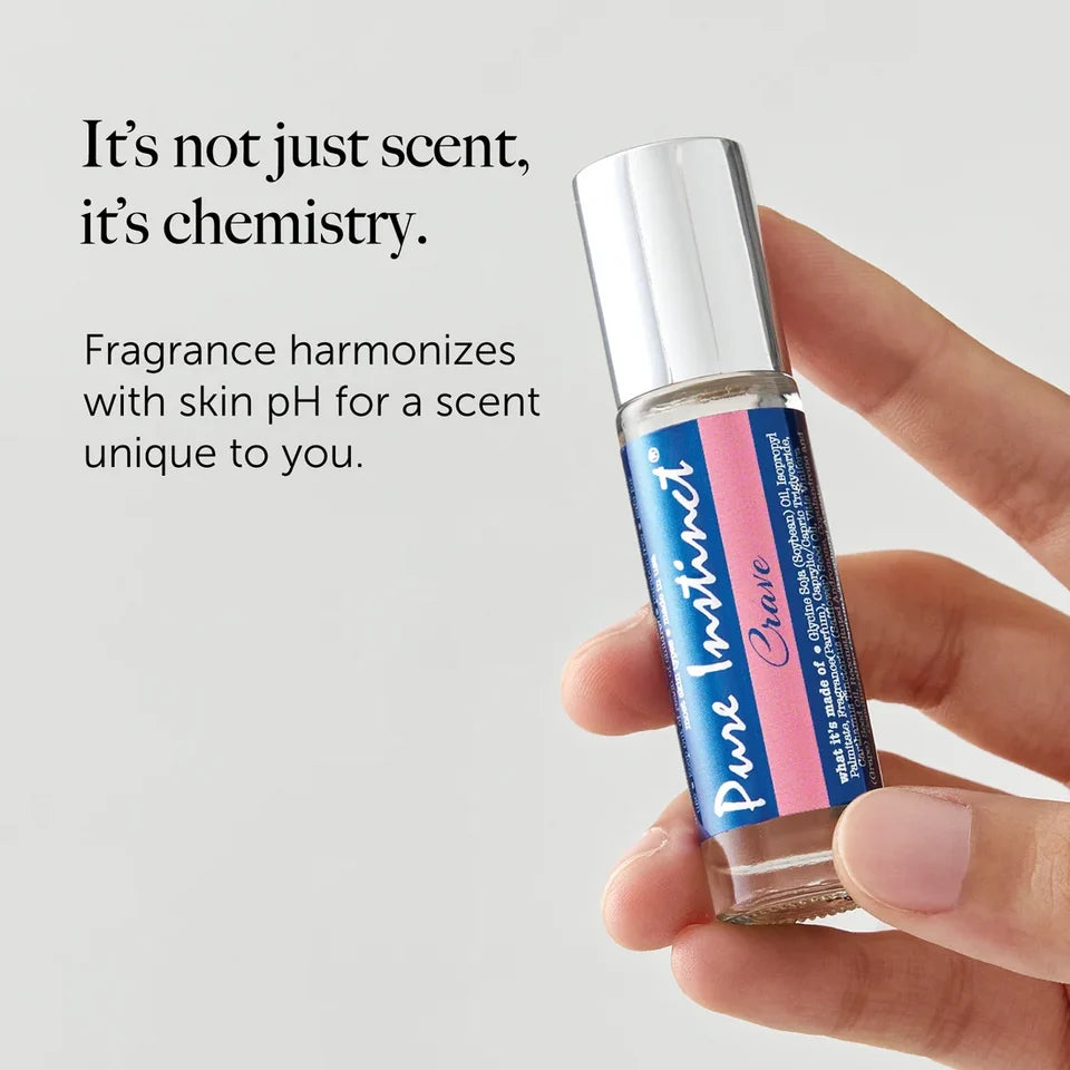 bottle of crave pure instinct pheromone oil held in hand