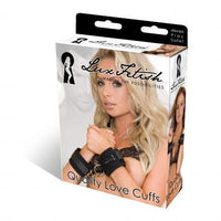 blonde female with black handcuffs on box cover