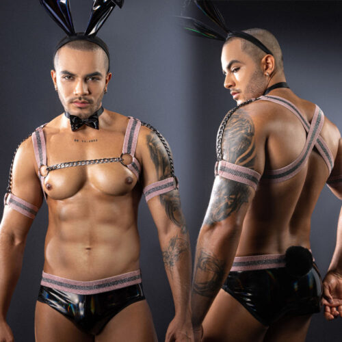 Man wearing a harness and rabbit ears against a dark background