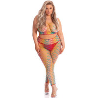 Woman wearing a colorful fishnet outfit on a white background