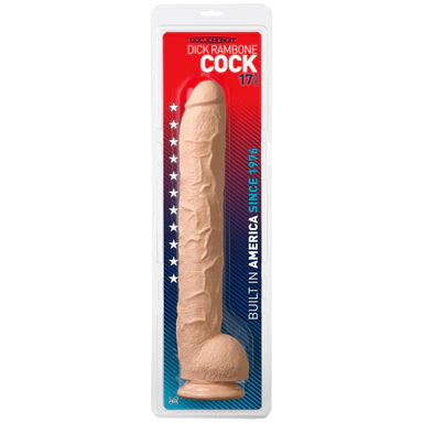 an extra long, thick beige detailed penis shaped dildo with balls and a suction cup base. It is shown in its plastic packaging