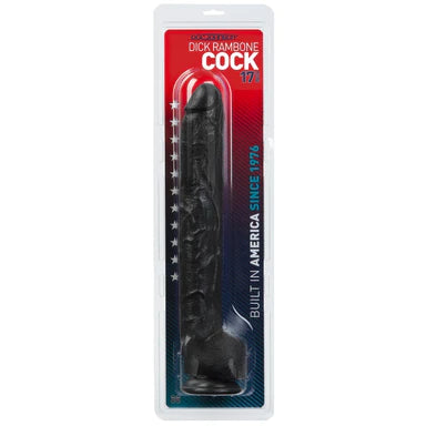 an extra long, thick black detailed penis shaped dildo with balls and a suction cup base. It is shown in its plastic packaging