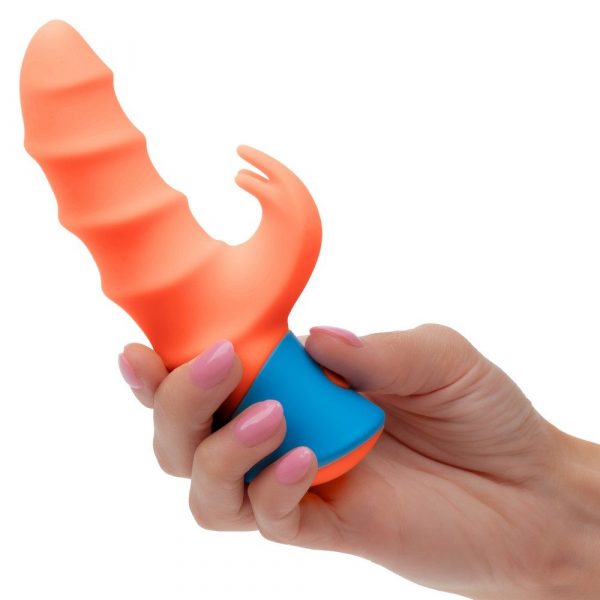 Hand holding a blue and orange rave tickler vibrator against a white background
