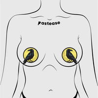 raven and moon pasties on female figure on breasts