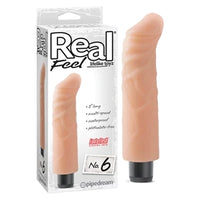 a beige penis shaped vibrator with a curved tip and a black cap, shown next to its white display box