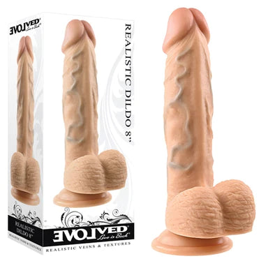 a beige detailed penis shaped dildo with balls and a suction cup. It is shown next to its white display box