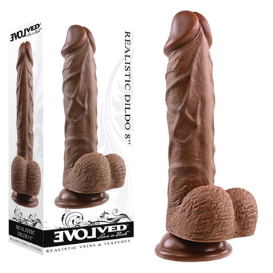 a brown detailed penis shaped dildo with balls and a suction cup. It is shown next to its white display box