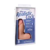 Product packaging of 'The Realistic Cock' by Doc Johnson on a white background