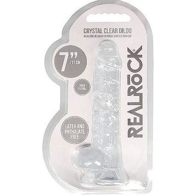 a clear detailed penis shaped dildo with balls and a suction cup. Shown in its plastic packaging.