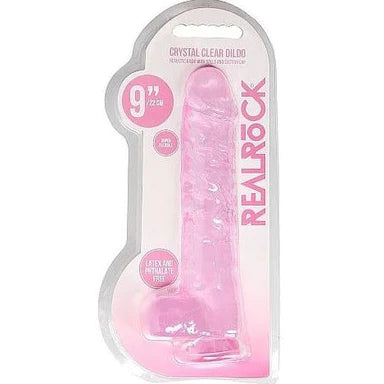 a pink detailed penis shaped dildo with balls and a suction cup. Shown in its plastic packaging.