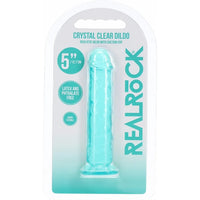 RealRock Crystal Clear Dildo in its original blister packaging, featuring a translucent light blue silicone dildo on a white and teal backing card.