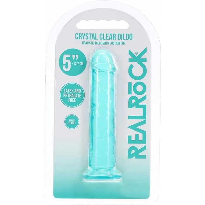 RealRock Crystal Clear Dildo in its original blister packaging, featuring a translucent light blue silicone dildo on a white and teal backing card.