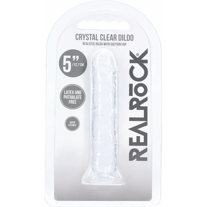 RealRock Crystal Clear Dildo in its original blister packaging, showing the transparent product inside a white and gray carded sleeve.