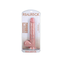 a long beige detailed penis shaped dildo with balls and a suction cup. Shown in its plastic packaging.