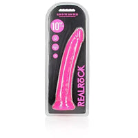 a glow in the dark pink penis shaped dildo with a suction cup base shown in its plastic packaging