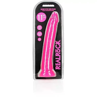 a glow in the dark pink penis shaped dildo with a suction cup base shown in its plastic packaging